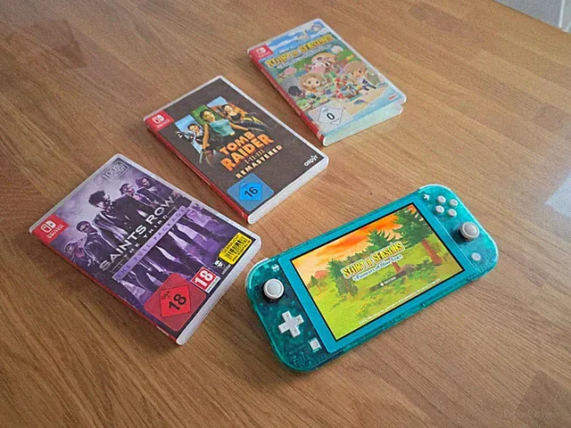 Nintendo Switch Lite 32GB Handheld-Spielekonsole - Türkis clear + 3 Spiele